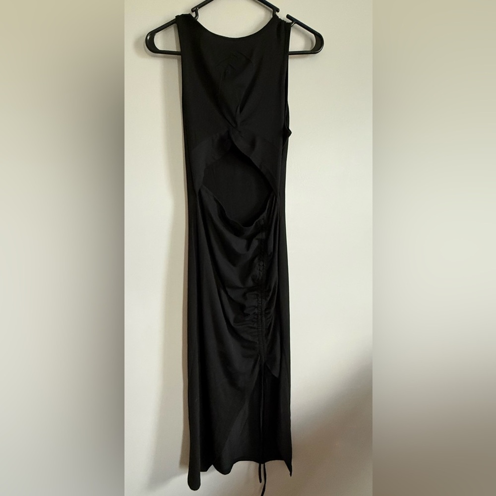 Elegant Black midi Dress with open midline detail and slit on leg size sm NWOT